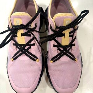 On Running Pink and Black Athletic Shoes with Streamlined Design